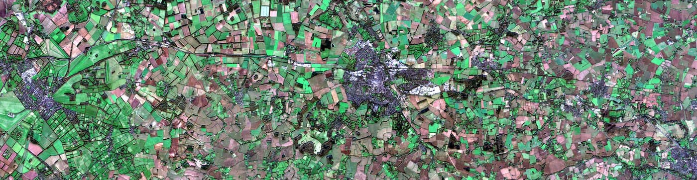 Satellite image of East Anglia, UK in late November 2024. Late-autumn field mosaic across the region.