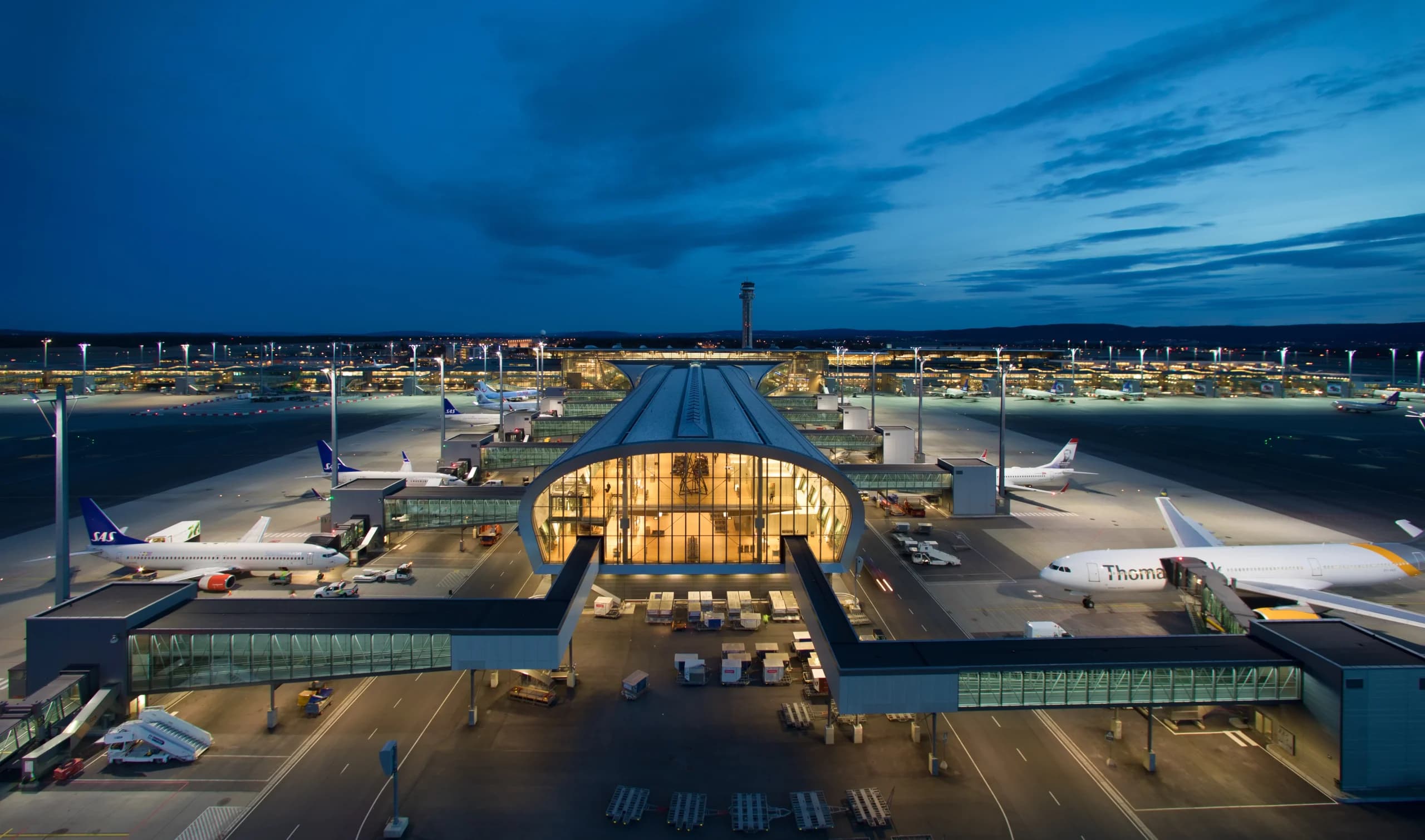 Aerial view of an airport at dusk, representing the sustainable aviation fuel supply chain